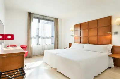 Cama o camas de una habitación en Hotel Zentral Ave