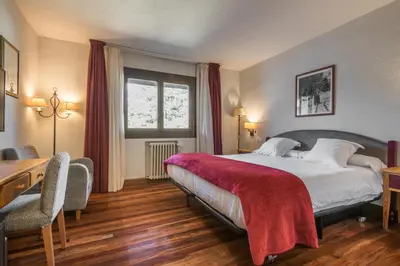 Cama o camas de una habitación en SNÖ Hotel Formigal