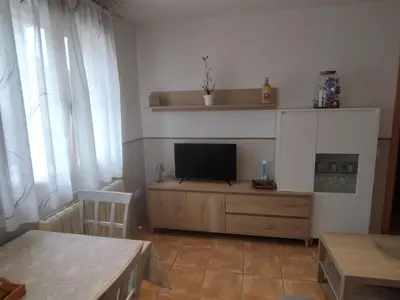 Una televisión o centro de entretenimiento en Apartamento Torre Sancho