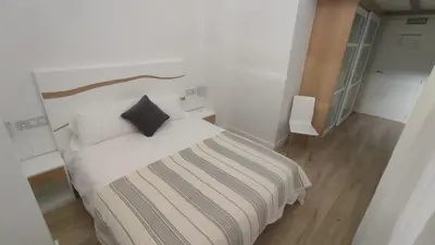 Cama o camas de una habitación en vivienda turística los Robles