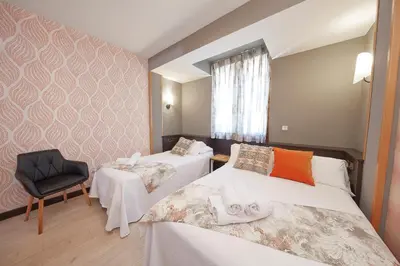 Cama o camas de una habitación en Hotel Sanchez