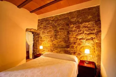 Cama o camas de una habitación en Masia Mas d'en Bosch Casa Rural Baronia de Rialb