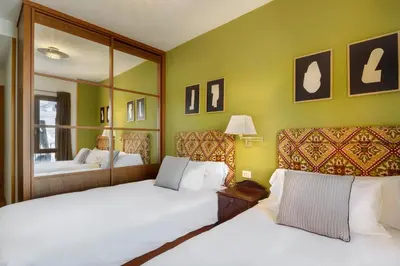 Cama o camas de una habitación en Montesqui Formigal, exclusivo ático con vistas a pistas, guardaesquis y garaje