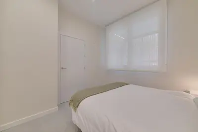 Cama o camas de una habitación en Apartamentos Pamplona Confort by Clabao