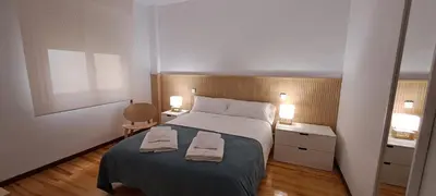 Cama o camas de una habitación en Erdizka, céntrico apartamento turístico con la mejor vista Plaza de los Fueros