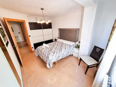 Cama o camas de una habitación en El Reloj del Pilar ComoTuCasa