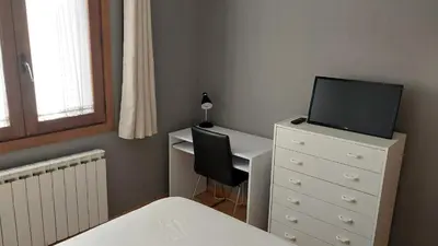 Una televisión o centro de entretenimiento en Apartamento en Villanua La Espata