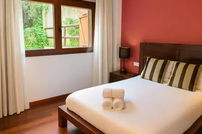 Cama o camas de una habitación en Vall Fosca - Apartamento con espectaculares vistas y jardín privado