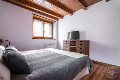 Cama o camas de una habitación en CASA REINA de Alma de Nieve