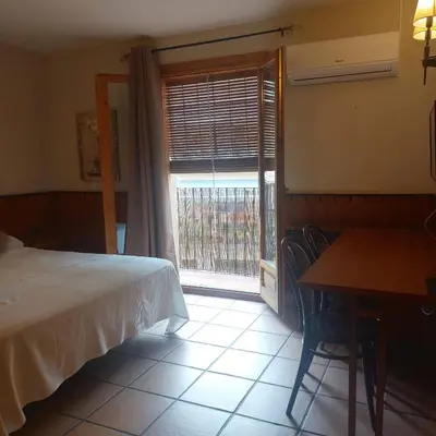 Cama o camas de una habitación en Hostal Tastavins