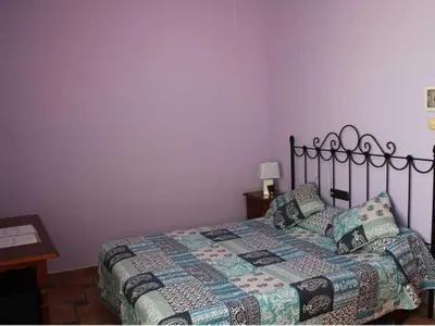 Cama o camas de una habitación en HOSTAL LA SAVINA