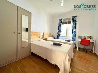 Cama o camas de una habitación en Dos Torres Saruman - Espacioso con 7 Camas Individuales
