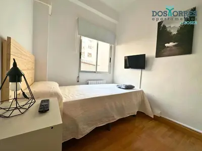 Cama o camas de una habitación en Dos Torres Saruman - Espacioso con 7 Camas Individuales