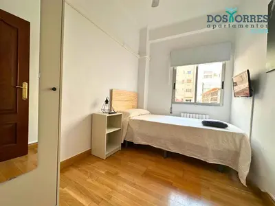 Cama o camas de una habitación en Dos Torres Saruman - Espacioso con 7 Camas Individuales