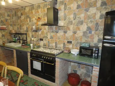 Una cocina o zona de cocina en Casa Rural El Pescador